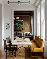 Spacious traditional dining room with banquette seating [from: Love Mixing The Seating Around A Dining Table Large Mustard Banquette Plus Individual Seats More House Interior Dining Room Inspiration Modern Dining Room