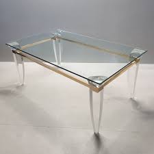 Be the first to write a review. Vintage Lucite Gold Plating And Glass Coffee Table With Assymetrical Table Legs Design Market