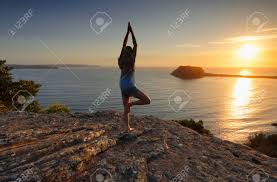 Check spelling or type a new query. A Woman Standing On A Rock Looking Out To The Sea At Sunrise Doing Tree Pose Variation Yoga Meditation Vrksasana Stock Photo Picture And Royalty Free Image Image 73765528