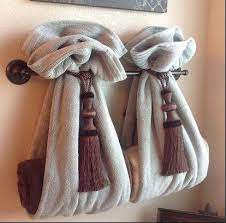 Adding extra shelving, baskets, towel bars, and hooks is always a good idea. Decorating Bathroom Hand Towels Bathroom Towel Decor Decorative Bath Towels Hang Towels In Bathroom