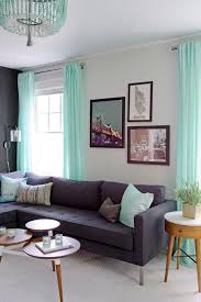 Adding gray to mint is a great way to soothe its natural energy. Mint Green Is The Perfect Accent Color For This Black And White Living Room A Dark G Green Furniture Living Room Contemporary Home Decor Living Room Turquoise