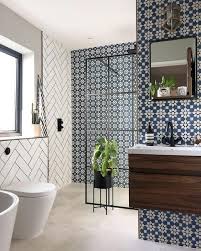 This modern bathroom uses statement wall tiles for a chic, urban look that would look great in a high rise apartment or a townhouse. 29 Ideas For Gorgeous Shower And Bathroom Tiles