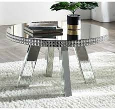 A coffee table is the focus of any living room furniture layout and creates the perfect spot for entertaining. Lotus Mirrored Round Coffee Table With Faux Crystals By Acme