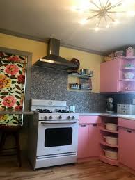 1953 Sears Steel Kitchen Cabinets Painted Pink Take Center Stage In Monica S 900 S F Cabin Kitchen Remodel Kitchen Cabinets Painting Kitchen Cabinets Steel Kitchen Cabinets