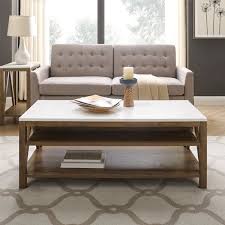 A coffee table is a low table designed to be placed in a sitting area for convenient support of beverages, remote controls, magazines, books (especially large, illustrated coffee table books), decorative objects, and other small items. Puzzle Coffee Table Wayfair