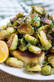 Tin Roof Bistro Brussels Sprouts Are Caramelized And Tossed In A Lemony Caper Butter Sauce The Most Popu Brussels Sprouts Recipe Brussel Sprouts Veggie Dishes