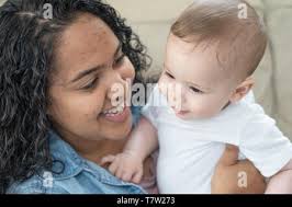 A mother holds her newborn baby in the bomb shelter of a maternity  hospital.Russia said it would press forward with its invasion of Ukraine  until its goals are met, as troops were