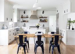 Navy Blue Tolix Chairs At Wood And Brass Dining Table Cottage Kitchen