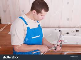 plumber fitting tap on kitchen sink