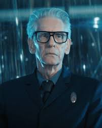 What are everyone's theories about the nature of David Cronenberg's  character Dr. Kovich in Discovery? Personally I think he's there to be kind  of like Guinan was in TNG. I don't think