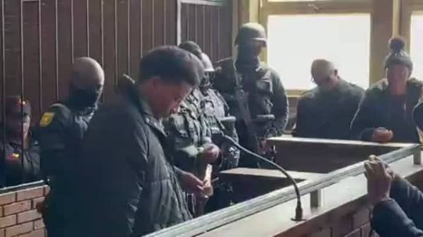 A 23-year-old suspected gangster accused of killing two Gauteng Anti-Gang Unit officers and two women has been remanded in custody. Regan Collis appeared in the Boksburg Magistrates' Court, facing four counts of