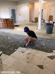 Learning how to remove tiles can seem like a daunting process. Removing Tile And Thinset From Concrete Sawdust Girl Concrete Floors Diy Tile Removal Concrete Tile Floor