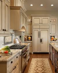 Red granite boasts black, gray, burgundy, brown, and red overtones which glisten beautifully in the kitchen's natural light. Cream Kitchen Cabinets With Black Countertops Novocom Top