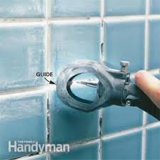Beware that grout like paint is made in batches and that there might be a variation from one package to the next. How To Regrout Bathroom Tile Fixing Bathroom Walls Diy Family Handyman
