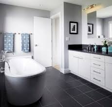 Bathroom floor tiles play an important role in the interior design of your home. How To Use Dark Floors To Brighten Your Dull Home Black Bathroom Floor Dark Gray Bathroom Gray Tile Bathroom Floor