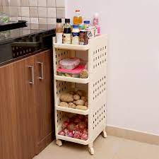 Whether you're looking for extra shelving to hold your large appliances or some convenient hooks to hang your pots and pans, a kitchen shelf organizer is thoughtfully designed to accommodate all your needs and wishes. Kurtzy Vertical Rack 4 Layer Plastic Storage Organizer With Wheels For Kitchen Ivory Polished Finish Amazon In Home Kitchen