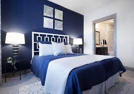 Stunning white and baby blue luxury bedroom decor with extra wide extended headboard bed #bedroom #bedroomdecor elegant modern all white cozy bedroom decor with white channel tufted velvet bed. Elegant Blue Bedroom Designs With Iron Beds Decorated Lamps White Walls Dormitorios Dormitorio Azul Hogar