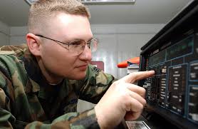 SENIOR AIRMAN (SRA) Patrick Winters, USAF, Satellite Wideband Telemetry  Systems Journeyman, 31st Communications Squadron (CS), Aviano AB, Italy,  programs a Firebird 6000 communications analyzer. SRA Winters participated  in a training exercise to