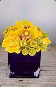 Incredibly Yellow Floral Arrangement Of Craspedia Roses And Cymbidium Yellow Flower Arrangements Flower Arrangements Center Pieces Yellow Orchids Centerpiece