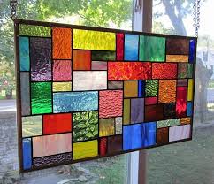 This alluring framed stained glass design in aquas and textured clear evokes calm. Stained Glass Window Hanging Panel