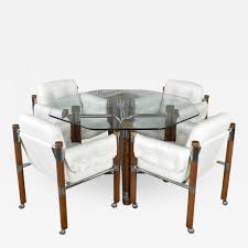 This table can accomodate up to four people comfortably, with standard dining height chairs. Modern Game Table Or Dining Table Glass Chrome Oak With 4 White Rolling Chairs