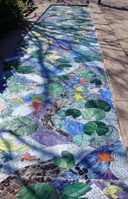 Stone mosaics provides wholesale tile distributor and natural stone distributor services to the palm bay, fl area. Garden Art Mosaic Designed By Artist Heather Anderson We Ve All Seen Mosaic Stepping Stones That Make A Pathway Sparkle B Mosaic Art Mosaic Walkway Mosaic