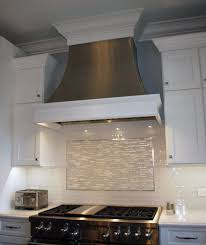 A Custom Metal Range Hood With Decorative Wood Trim Shows You Can Have The Best Of Both Worlds Kitchen Range Hood Stainless Range Hood Kitchen Hoods