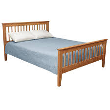 It features a clean, solid panel design and coffee finish. American Mission Bed Vermont Woods Studios