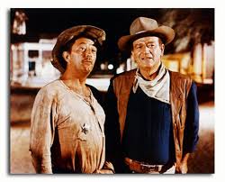 Robert mitchum, american film star whose roles as a cool, cynical loner combined with a notorious personal life and a sardonic, relaxed style to create a durable screen image as a fatalistic tough guy. Ss3331939 Filmbild Von John Wayne Promi Fotos Und Poster Bei Starstills Com Kaufen