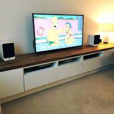 This modern and minimal ikea cabinet hack makes a great tv stand plus stylish storage for your living room and it won't break the budget either. 12 Incredible Ikea Hacks Ikea Tv Console Long Tv Unit Ikea Tv