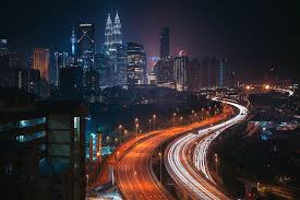 There's something about exploring a city's nightlife that offers a completely different experience, oftentimes exhilarating or even enigmatic. Hd Wallpaper Building Kuala Lumpur City Road Night Malaysia Lights Wallpaper Flare