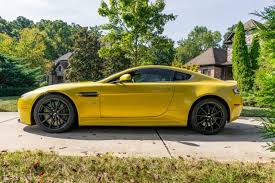 Image result for Sunburst Yellow 2012 Aston Martin