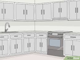 Our cabinet maker designed our corner drawer cabinet to have two deep drawers and one shallower drawer to match the size of the smaller upper drawers around the perimeter of the kitchen. 3 Simple Ways To Design Kitchen Cabinets Wikihow