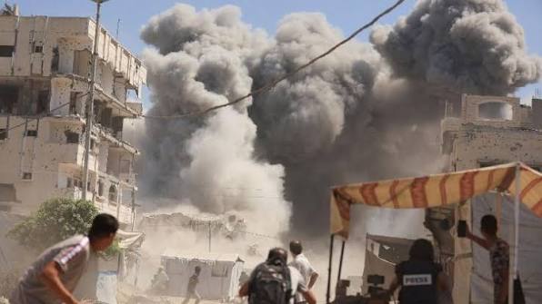 Smoke rises over Gaza City following a series of Israeli airstrikes.