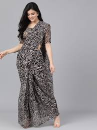 To check the originality of the patola saree, look for a locking design at the backside of the saree. Black Beige Animal Print Saree