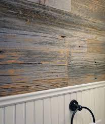 Grey Barn Wood Wall In A Bathroom Wood Panel Walls Reclaimed Wood Paneling Farmhouse Bathroom Decor