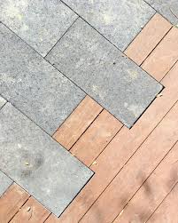 Custom Materials Flow Melding A Dark Stone Paver With Wood Decking Makes For A Elegant Finish To Any Patio Landscape Pavers Wood Deck Plans Hardscape