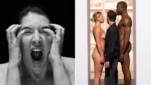 Marina Abramović invites visitors to squeeze through naked models