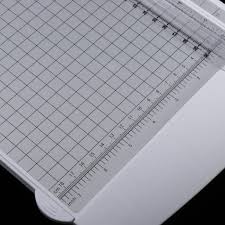 The device consists of a tall, upright frame with a weighted and angled blade suspended at the top. Buy Mini A4 Paper Trimmer Craft Cutter Safe Guillotine For Cutting At Affordable Prices Free Shipping Real Reviews With Photos Joom