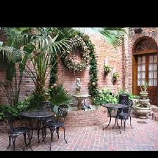 Iconic New Orleans Architecture French Quarter Courtyards Gonola Com Brick Courtyard Courtyard Design New Orleans Architecture