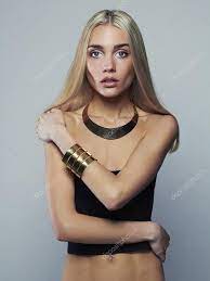 Beautiful thin model. young blonde woman. fashion girl in jewelry Stock  Photo by ©EugenePartyzan 73931995