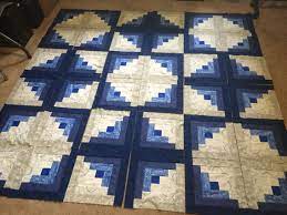 The blocks popularity may have been connected to abraham lincoln because of his pioneer history and the american values of the era. Layout For Cobalt Log Cabin Log Cabin Quilts Log Cabin Quilt Pattern Log Cabin Quilt Layouts