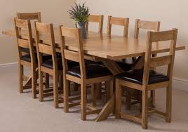 A solid oak dining table can last for decades and is one of the most worthwhile investments you can make for your furniture. Vermont Solid Oak 200cm 240cm Crossed Leg Extending Dining Table With 8 Lincoln Solid Oak Dining Chairs Light Oak And Brown Leather