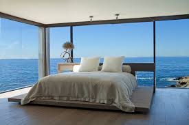 30 Floor To Ceiling Windows Flooding Interiors With Natural Light Freshome Com California Beach House Modern Beach House House Styles