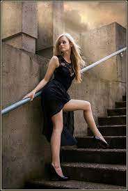 Olivia Preston In A Black Mini Dress Posing On Stairs Beautiful Women Wearing Mini Skirts Mini Black Dress Dress Poses Simple Outfits