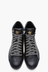 Adidas Black And Gold High Tops 12 Winter Tennis Outfits For Women You Will Totally Love Shoes Mens Sneakers Men Sneaker Boots