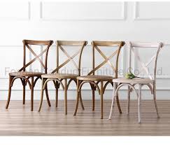The chair has a wooden backrest which is contoured. China Strong And Durable Solid Wood Cross Back Dining Chair With 5 Years Guarantee China Wedding Furniture Solid Wood Chair