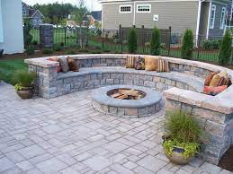 This small circular crushed gravel patio is situated in the far corner of the backyard and is bordered by paving stones and equipped with a wood table set and umbrella. Paver Contractor Jacksonville And Saint Augustine Florida Patio Pavers Design Pavers Backyard Patio Landscaping