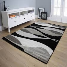 Tapis tufté main en inde, en soie végétale. Tapis Gris Et Noir Courbe Pour Salon Moderne Rectangle Foligno