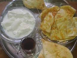 ريوق مال عيد كاهي وقيمر واستكان جاي وصمون حار الله A Breakfast Fit For Eid Kahi A Layered Pastry And Geymar Food Food Shapes Traditional Breakfast